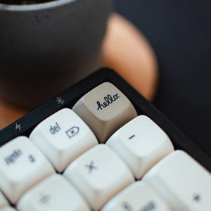 A computer keyboard with the word 'Hello' spelled out